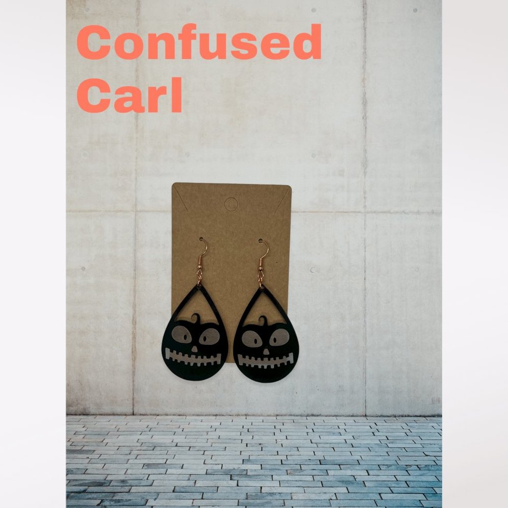 Confused Carl - Dangling Pumpkin Earrings